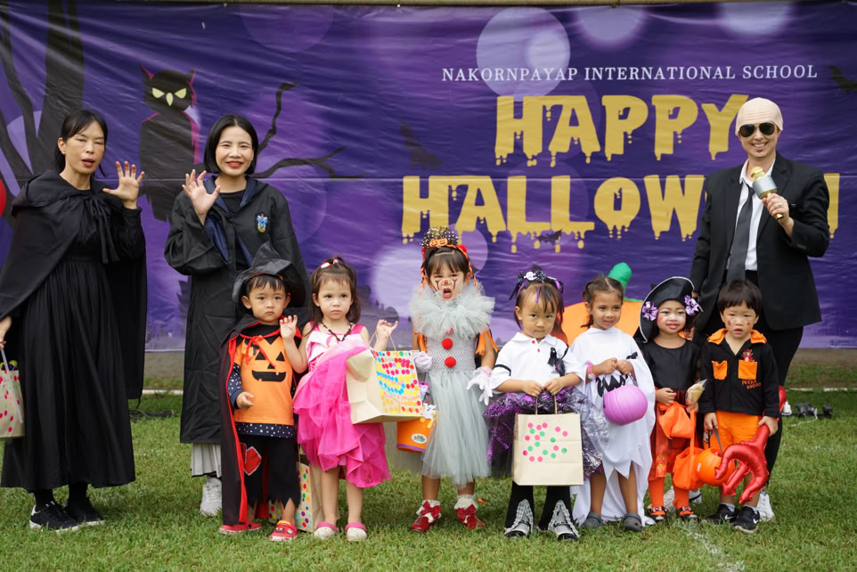 Group of children attentively listening, showcasing curiosity and focus during an event.