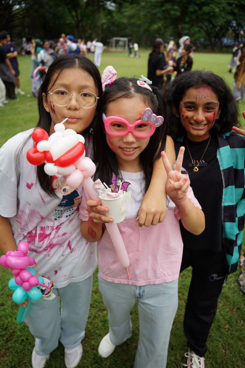 A mother helps her child paint in an art studio, fostering creativity and learning.